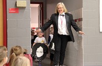 teacher and students entering gymnasium