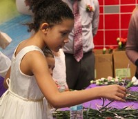 student picking out flower