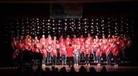 wide shot of students singing