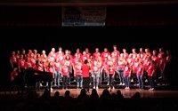 wide shot of students singing