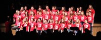 seventh and eighth grade students singing