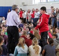 student in audience standing up to answer question