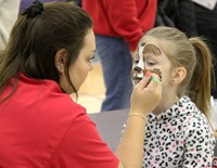 student getting face painted