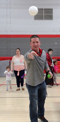educator throwing ball