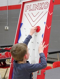 student playing community night game