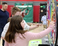 two students playing community night game