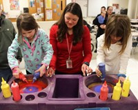 two students creating spin art