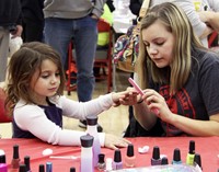 another student getting nails painted