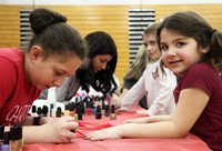 student getting nails painted