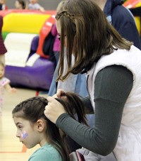 student getting hair done