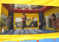 student jumping in bounce house