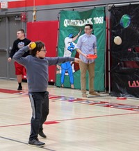 student throwing ball