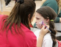 student getting face painted