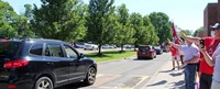 teachers waving to students in parade