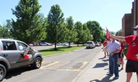 teachers waving to students in parade