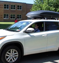 student driving in parade