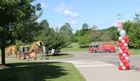 wide shot of fire truck leading parade