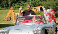 warrior mascot waving to cars