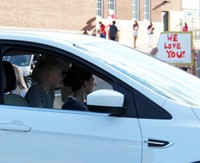 student and family member in car