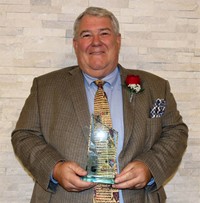 Jim McDaniel with Award
