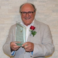 Rick Gehr holding award
