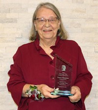 Sally Reutlinger with award