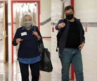 Joshua Miller giving Joan Mitrowitz Tymeson tour of high school