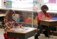 two students writing cards