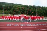 students throwing caps