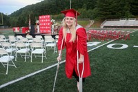 student standing next to 2021 sign