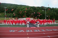 students throwing caps