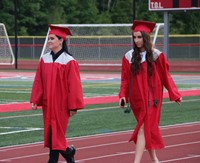 students walking into ceremony