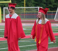 students walking into ceremony