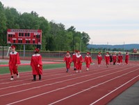 students walking into ceremony