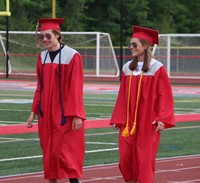 students walking into ceremony