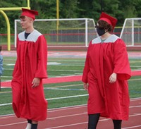 students walking into ceremony