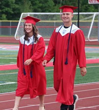 students walking into ceremony