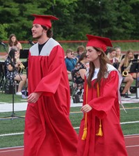 students walking into ceremony