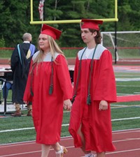 students walking into ceremony