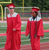 students walking into ceremony