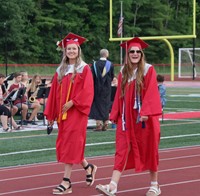 students walking into ceremony