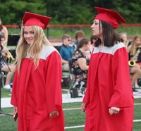 students walking into ceremony