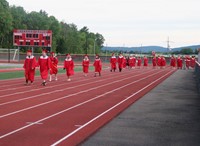 students walking into ceremony