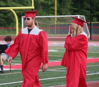 students walking into ceremony