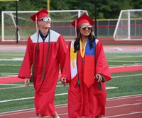 students walking into ceremony