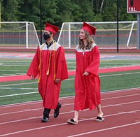 students walking into ceremony