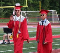 students walking into ceremony