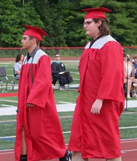 students walking into ceremony