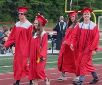 students walking into ceremony