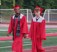 students walking into ceremony